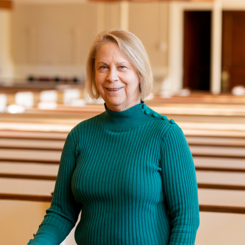 Meg Sweeting in the pews of Village Church