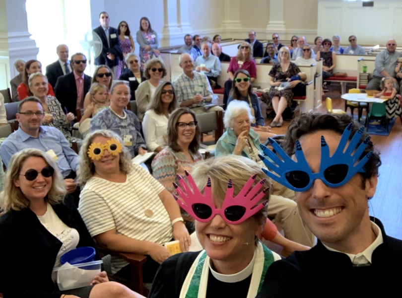 Pastors in sunglasses with congregation