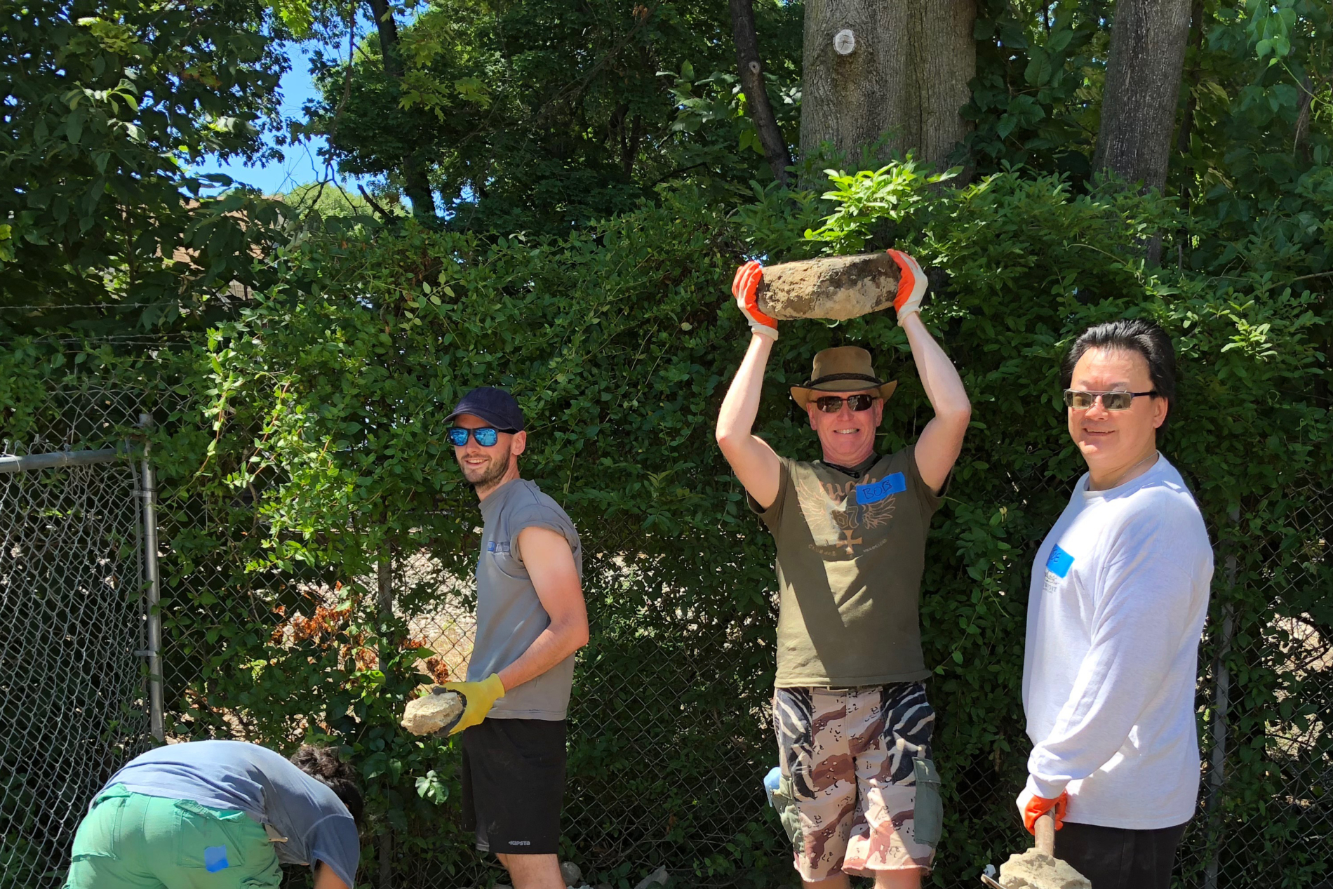 A group of men working at a Habitat for Humanity build