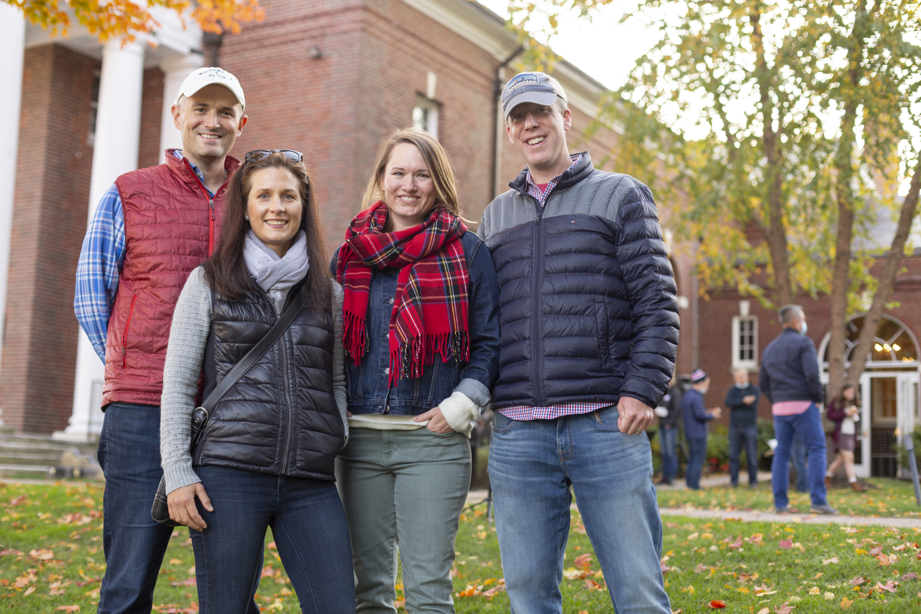 Two men and two women in front of the church